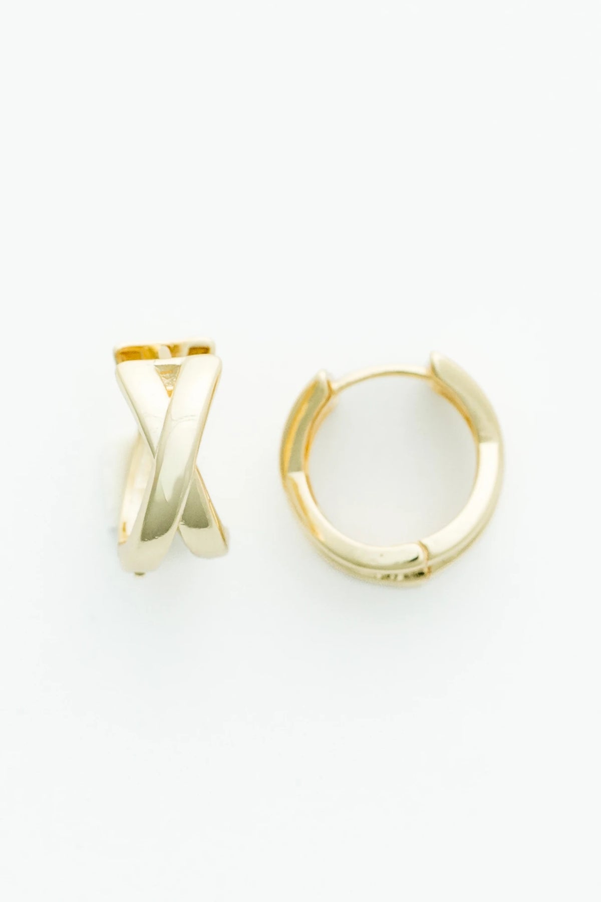 Gold-tone huggie earrings with a polished finish