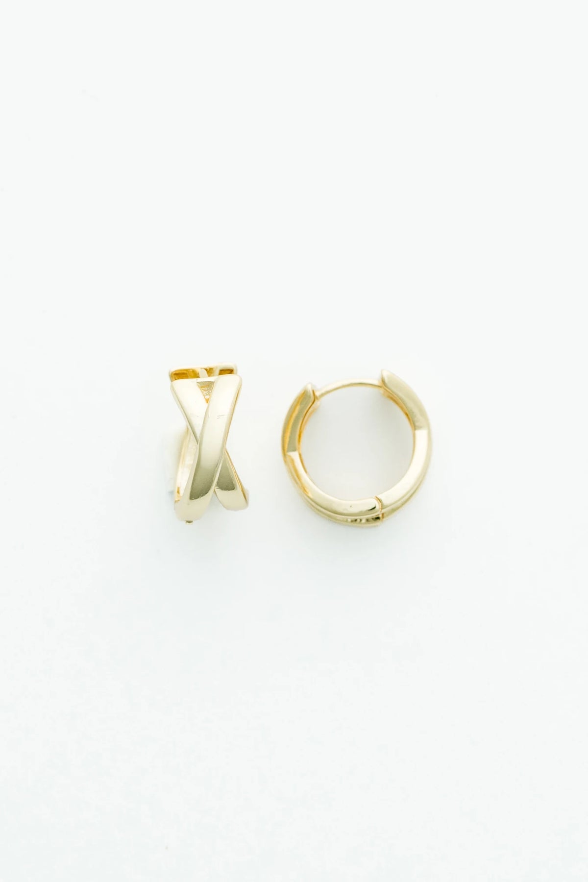Gold-tone huggie earrings with a polished finish