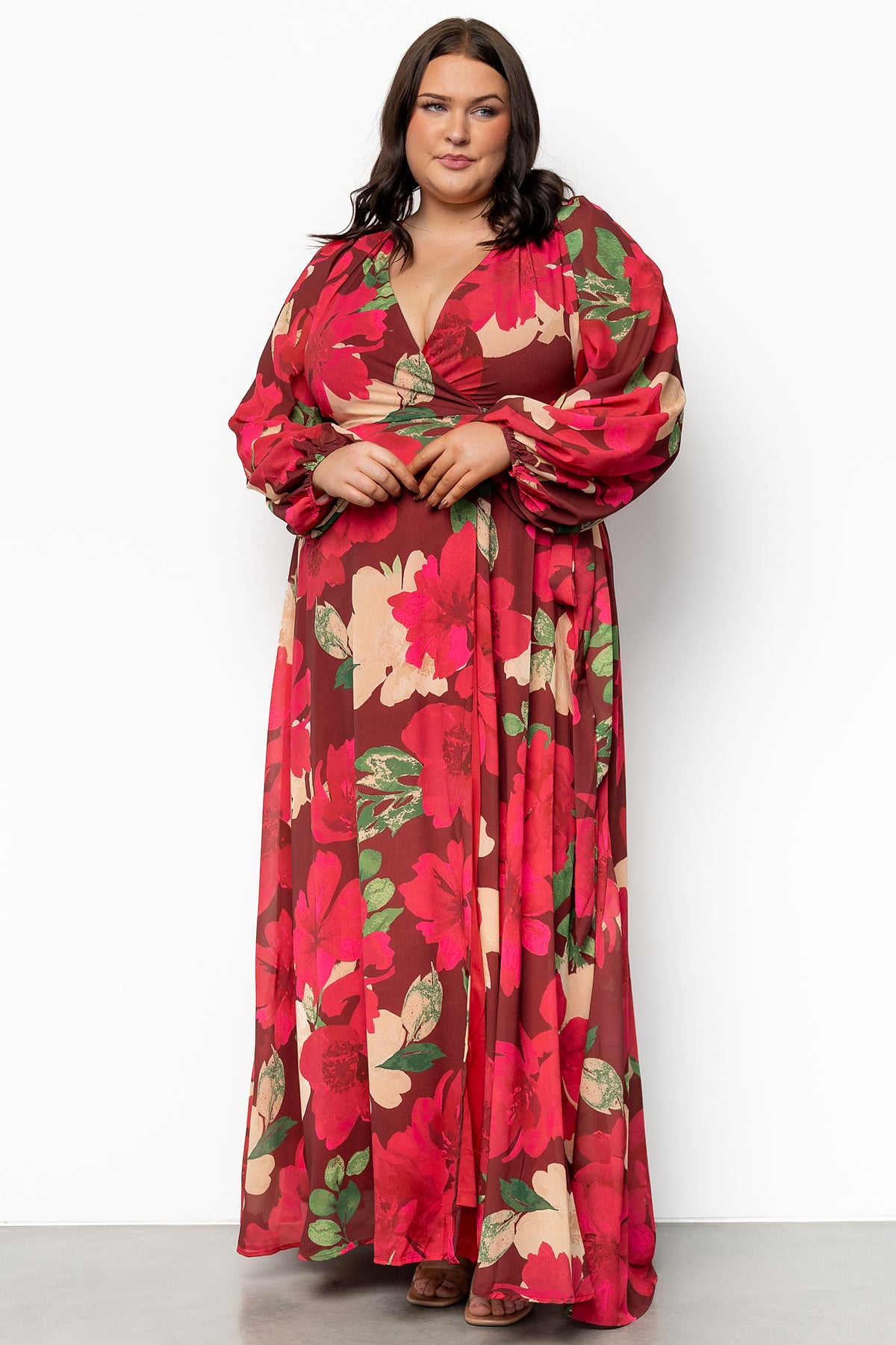Close-up of Katinka Wrap Maxi Dress fabric and print: burgundy background with pink, green, and ivory floral details on lightweight chiffon.