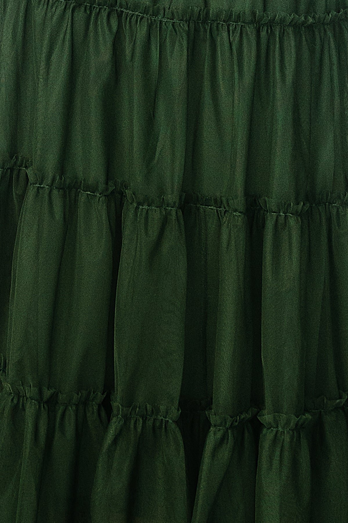 Close-up of Emma Tulle fabric swatch in Green, approx. 3 x 4 inches, showing sheer tulle texture and subtle color depth.