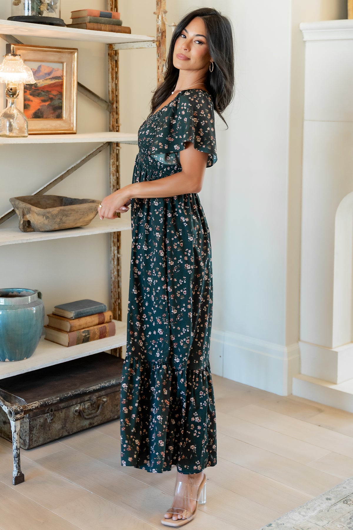 Model styling shot of the Jerah dress in motion, emphasizing the flowy single-tier skirt and elegant drape of the fabric.