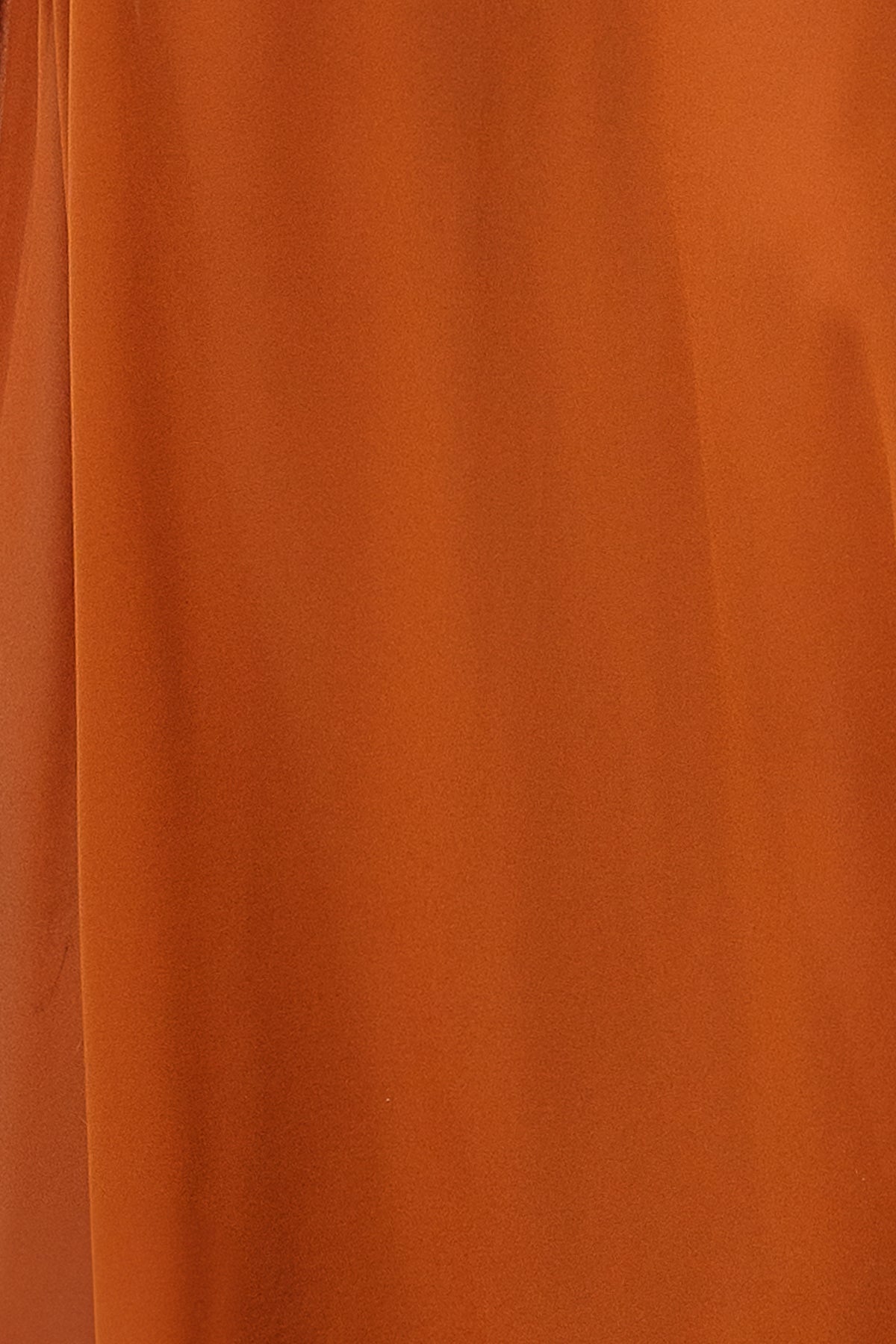 Flat lay of a 3 x 4 inch Spice chiffon fabric swatch for the Victoria dress, showing true color and slight sheerness.