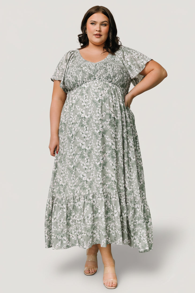 Close-up of smocked bust and flutter sleeve on Joanie Smocked Midi Dress, highlighting center seam and delicate sage floral print.
