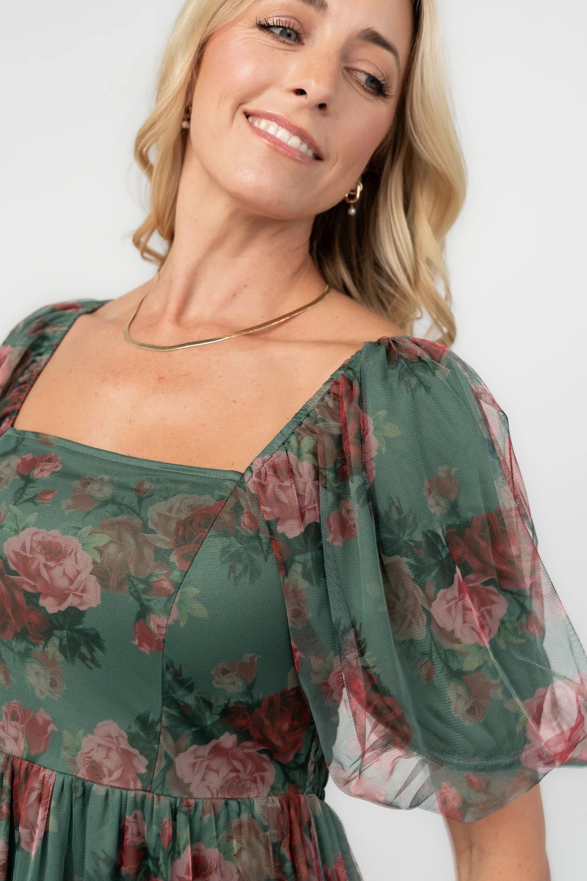 Floral tulle midi dress with a square neckline, short puff sleeves, smocked back, tiered skirt, and flowing silhouette.