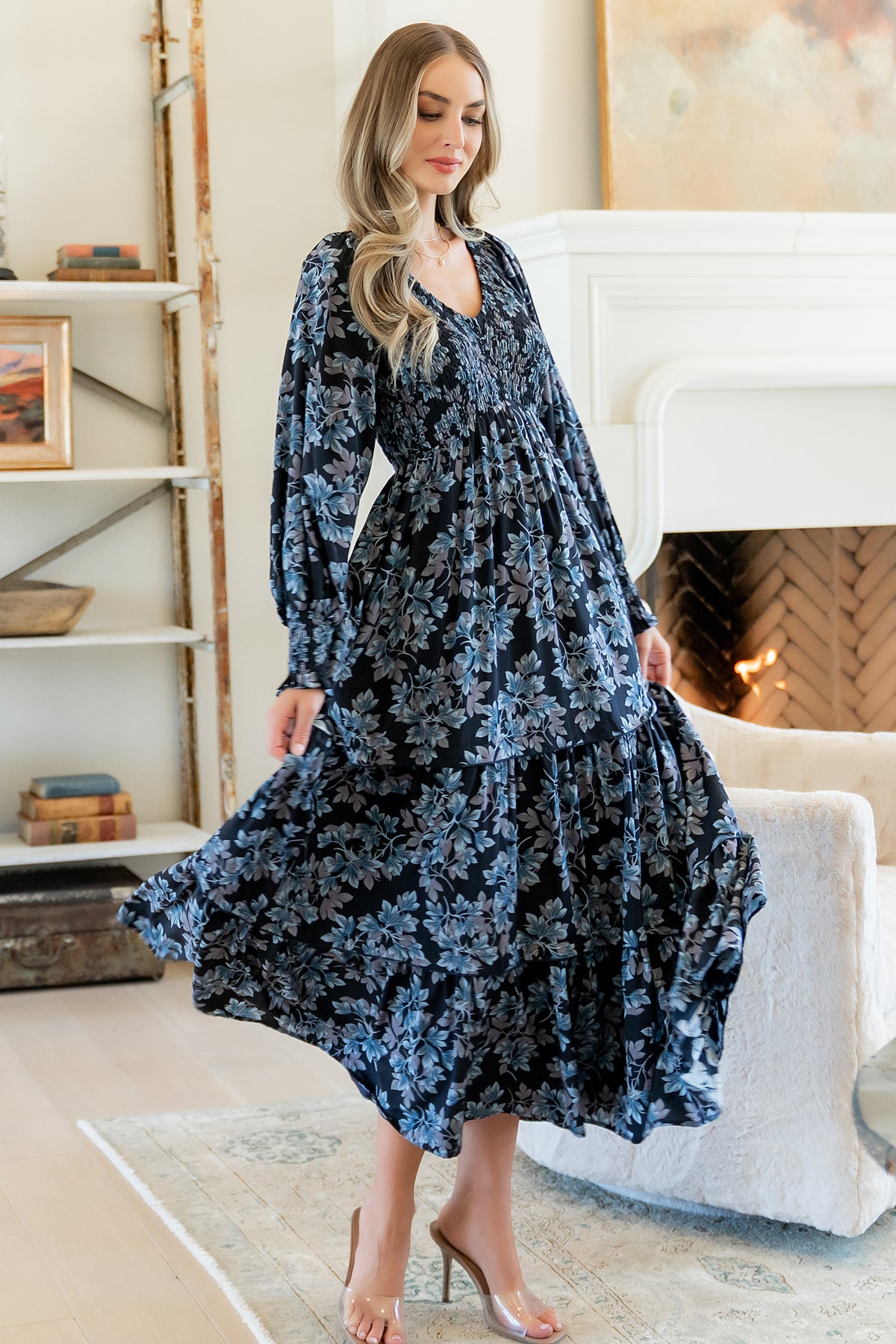 Fabric and sleeve detail close-up showing long sleeve with smocked cuff and the midnight blue multi-floral print.