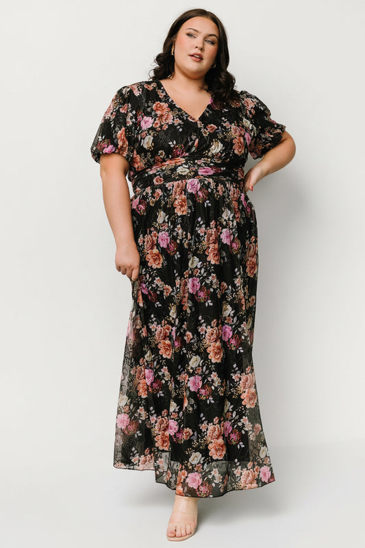 Front view of Ardley Maxi Dress in black multi floral showing V-neck, short puff sleeves, embroidered mesh overlay, and flowing maxi skirt.