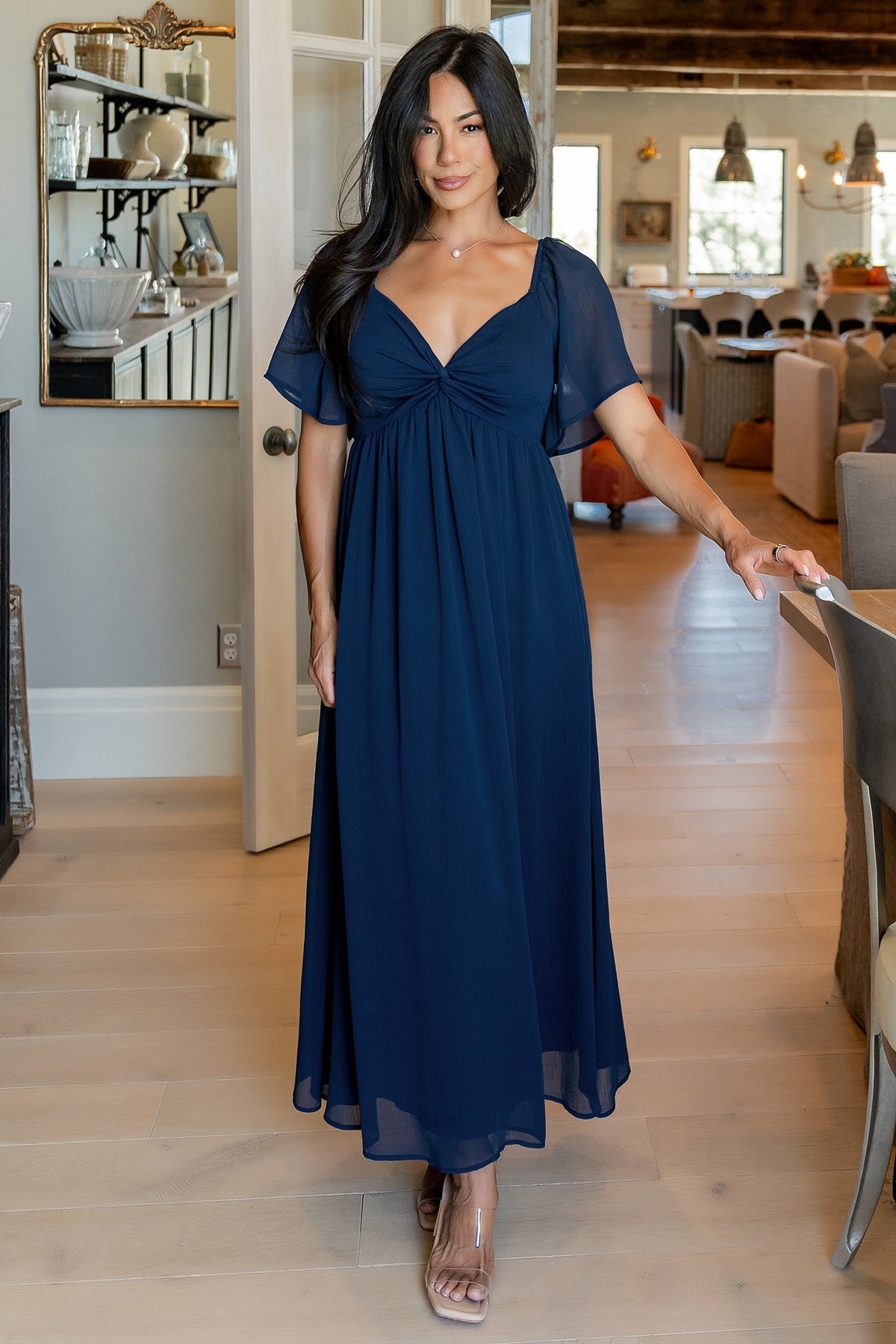 Detail shot of the Nora Midi Dress fabric and knotted bust in navy georgette, highlighting lining at the bodice and fine horizontal seaming.