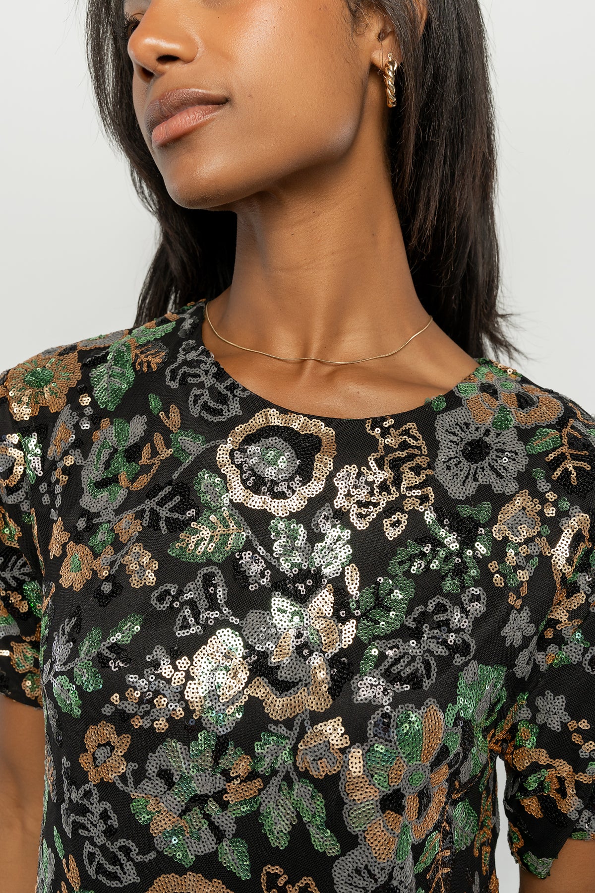 Full-length shot of the Squires sequin short dress on model, illustrating short skirt length and overall silhouette for occasion wear.