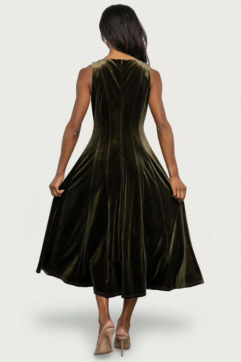 Model walking in Annika Olive velvet midi dress demonstrating movement, mid-calf length, and how the princess seams shape the silhouette.