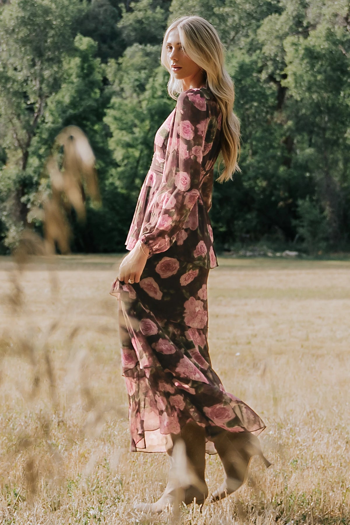 Mariella Tiered Maxi Dress in Deep Plum Floral with V-neckline, long puff sleeves, smocked back, and cascading ruffles.