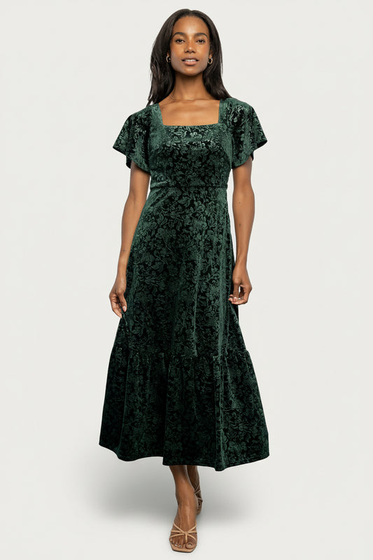 Full-length front view of Eirene burnout velvet maxi dress in emerald, showing square neckline and flowing single-tiered skirt.