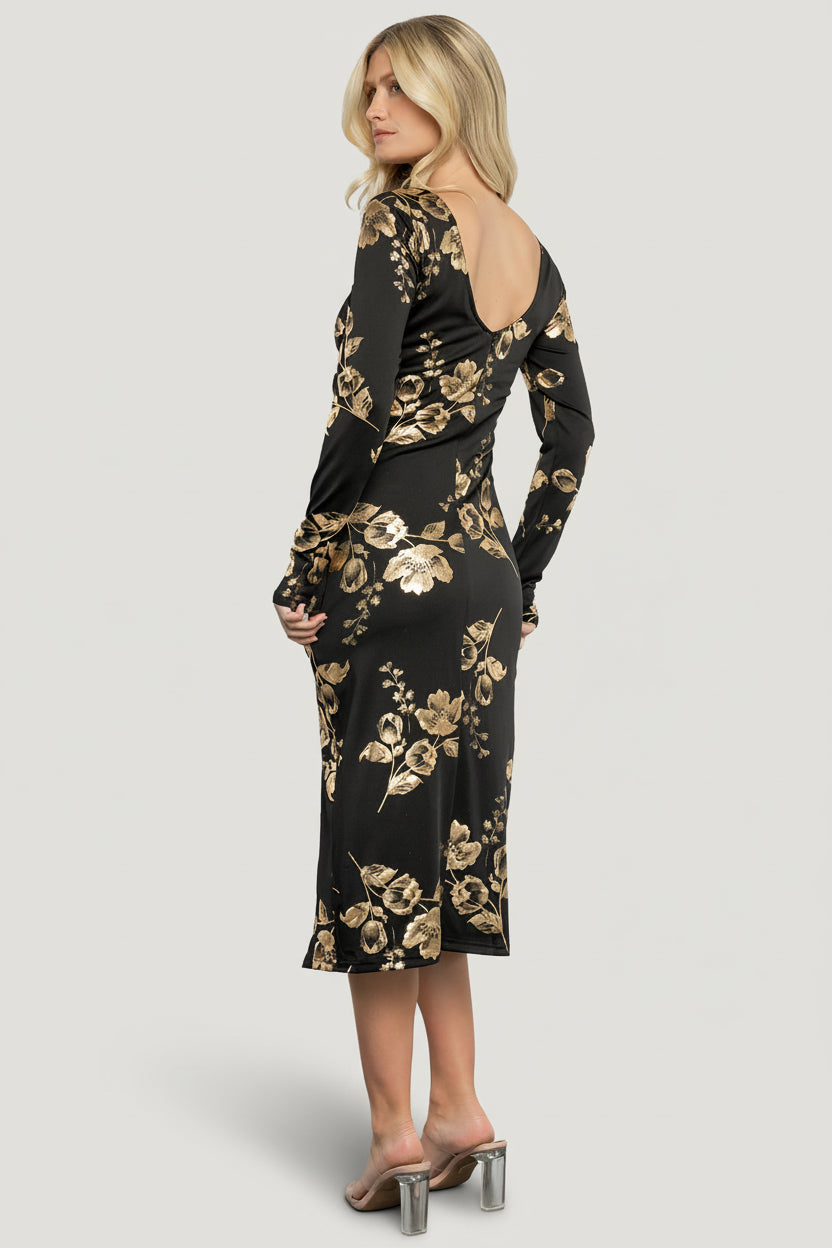Close-up of the gold metallic floral pattern on black luxe knit, showing texture, metallic finish, and knit stitch detail.