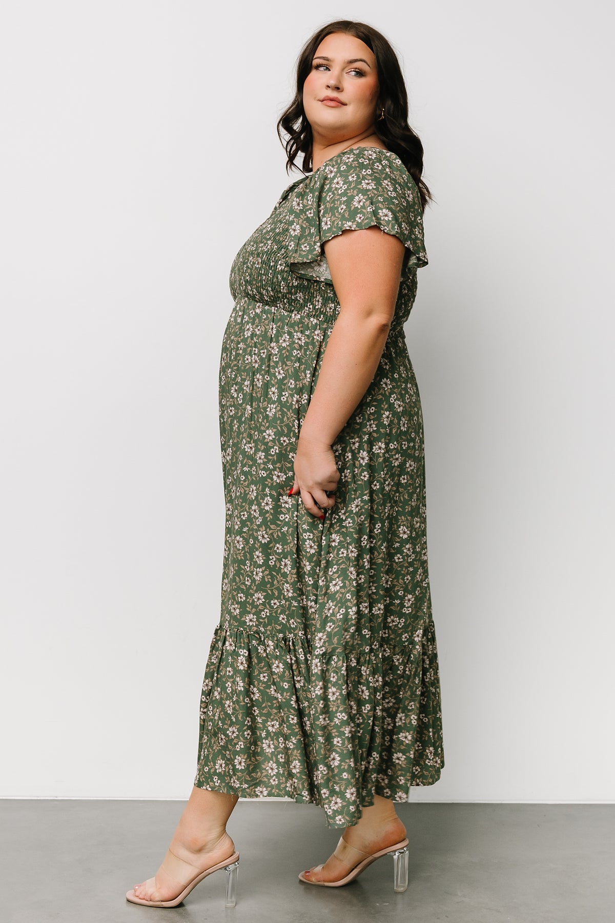 Back and sleeve detail photo showing unlined flutter sleeves, back seam shaping, and even print distribution across the skirt panels.