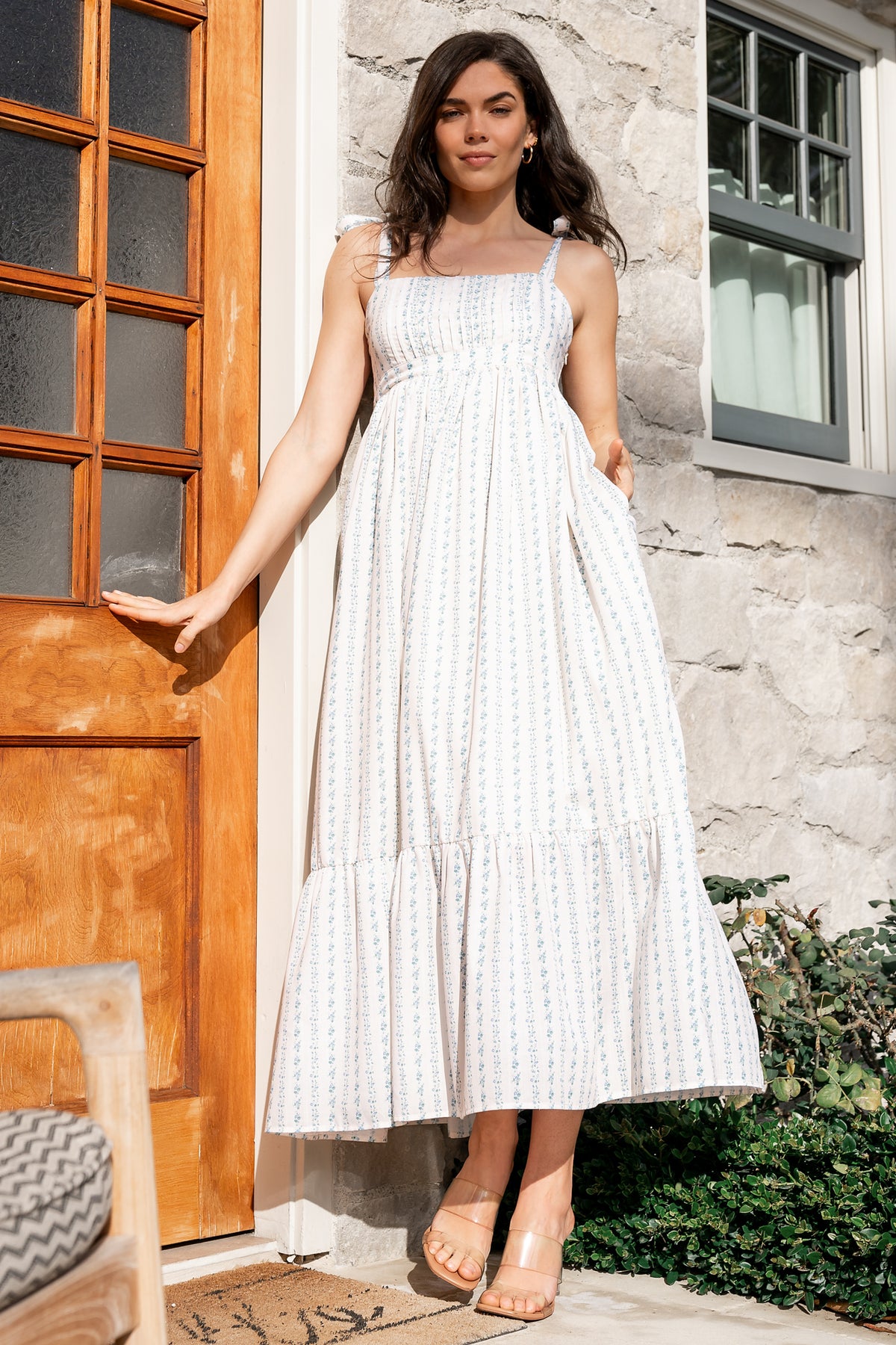 Front view of Kennie Maxi Dress in cream multi floral with square neckline, pleated bodice, smocked back, and hidden side pockets, full length.