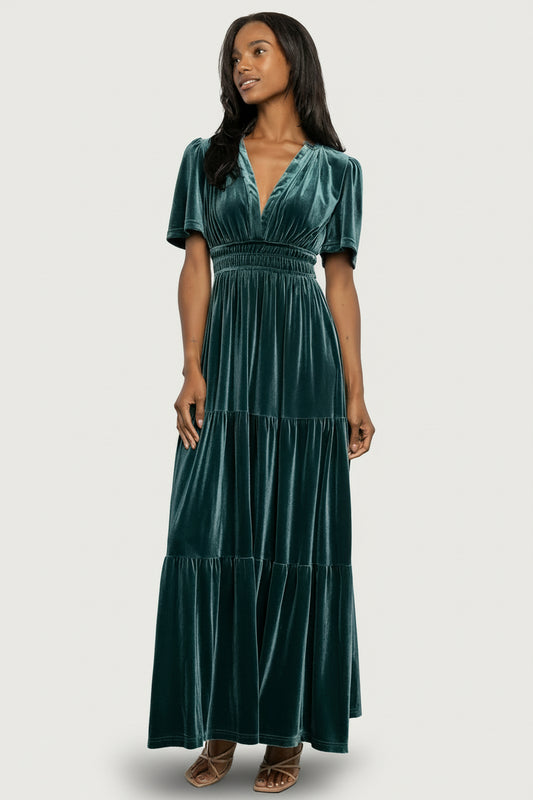 Front view of the Artemis Deep Lagoon velvet maxi dress on a model, showing the plunging V-neck and short flutter sleeves.
