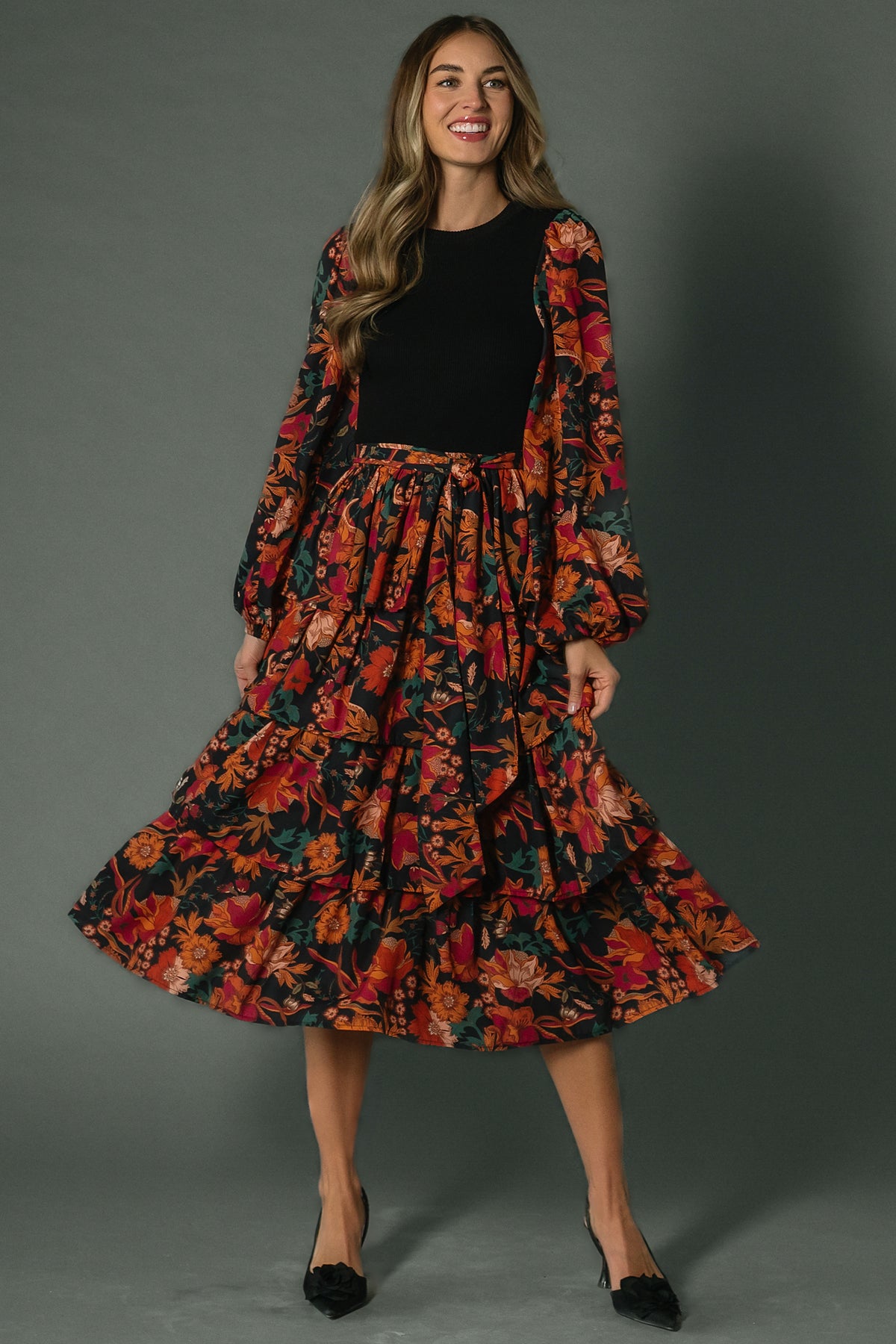 Front view of Sylvie Tiered Midi Dress in black multi floral, showing knit bodice, tiered chiffon skirt and removable belt.