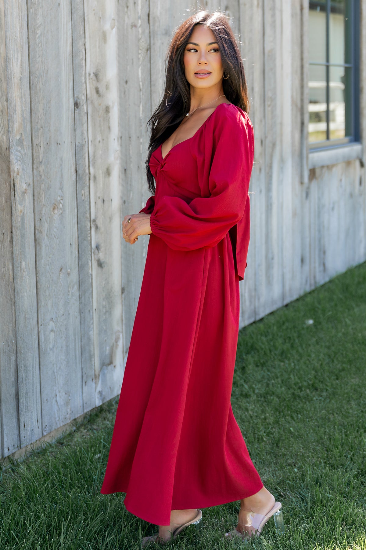 Full-length shot of model in scarlet Rosalie Back Tie Dress demonstrating midi hemline and versatile styling for events.