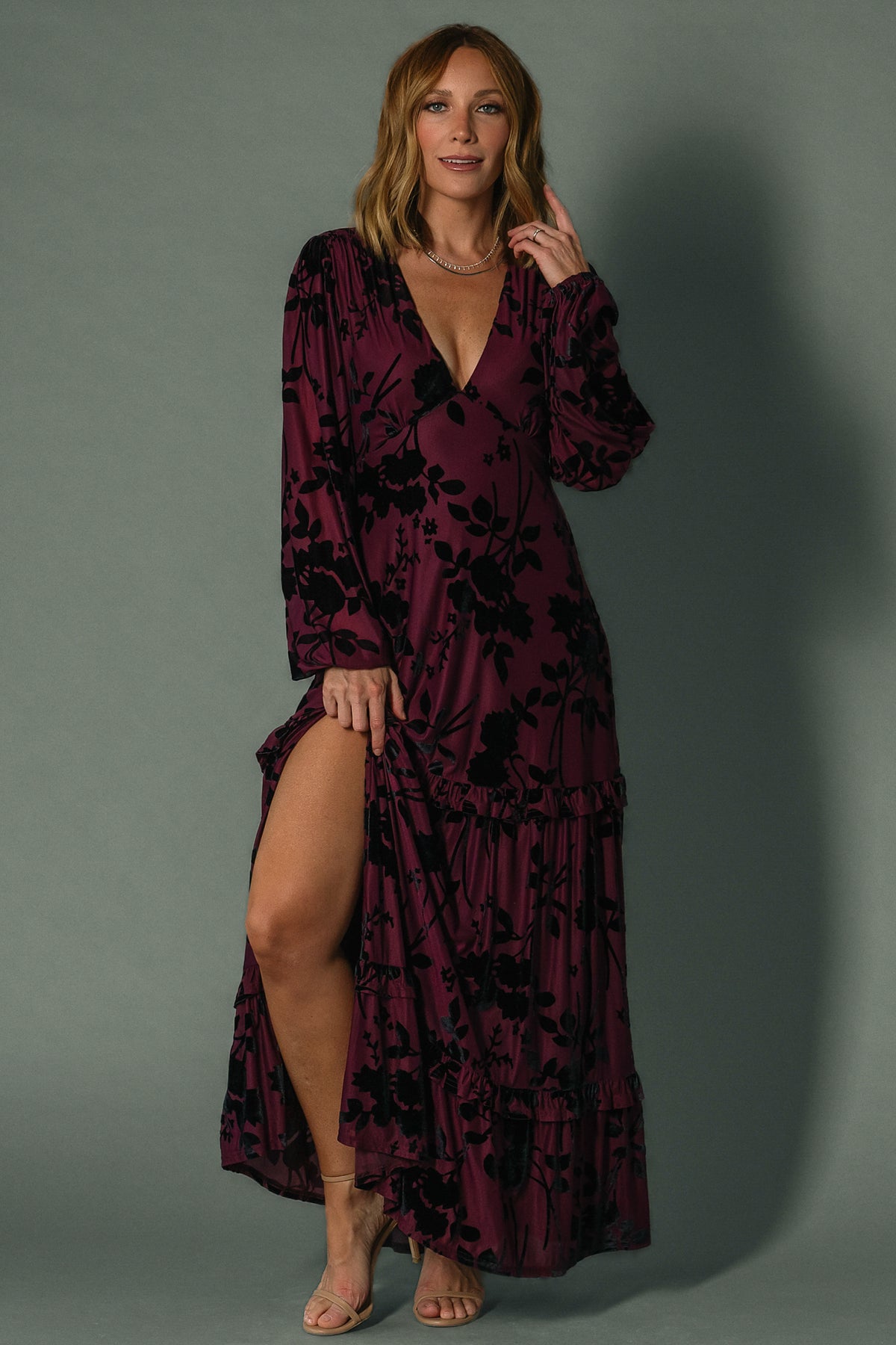 Side view of mulberry maxi dress on model highlighting elastic back waist, hidden side zipper, and gathered bust seam.