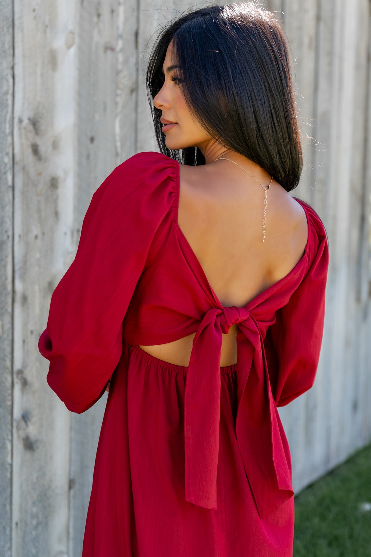 Close-up of the Rosalie dress fabric and front pleats, showing texture and the delicate rayon-blend composition.