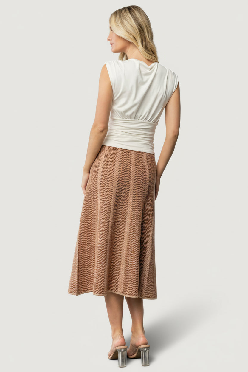 Waistband detail of Astrid Midi Skirt showing high-rise, elastic waistband and knit finish for comfortable, secure fit.