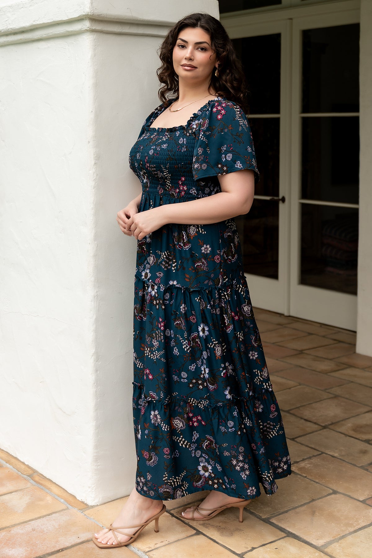 Three-quarter angled view of Southampton maxi in jade blossom showing skirt tiers, ruffle trim, and the dress’s flow and length while walking.