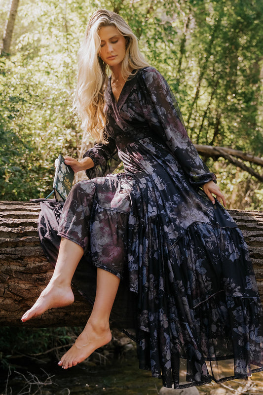 Rhiannon Maxi Dress in Midnight Floral with surplice V-neck, self-tie waist, sheer sleeves, and tiered mesh skirt.