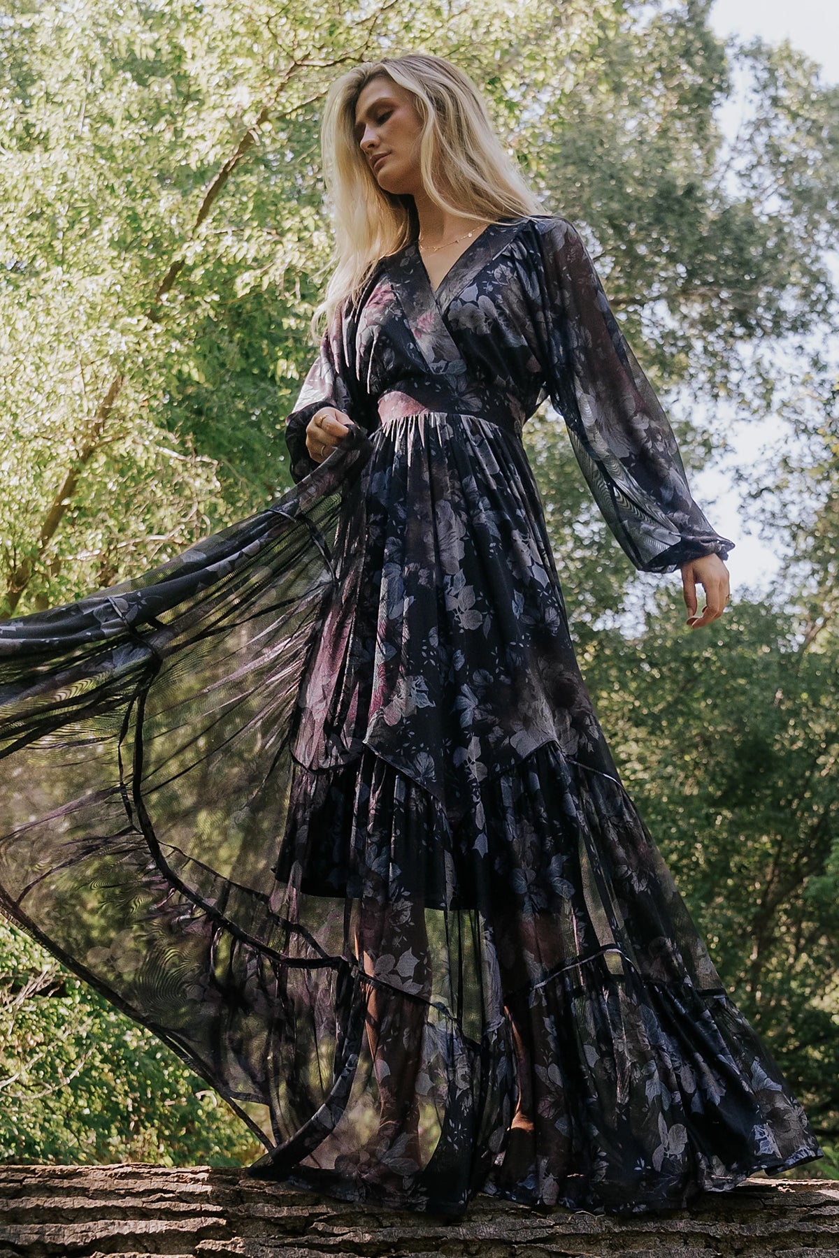 Rhiannon Maxi Dress in Midnight Floral with surplice V-neck, self-tie waist, sheer sleeves, and tiered mesh skirt.