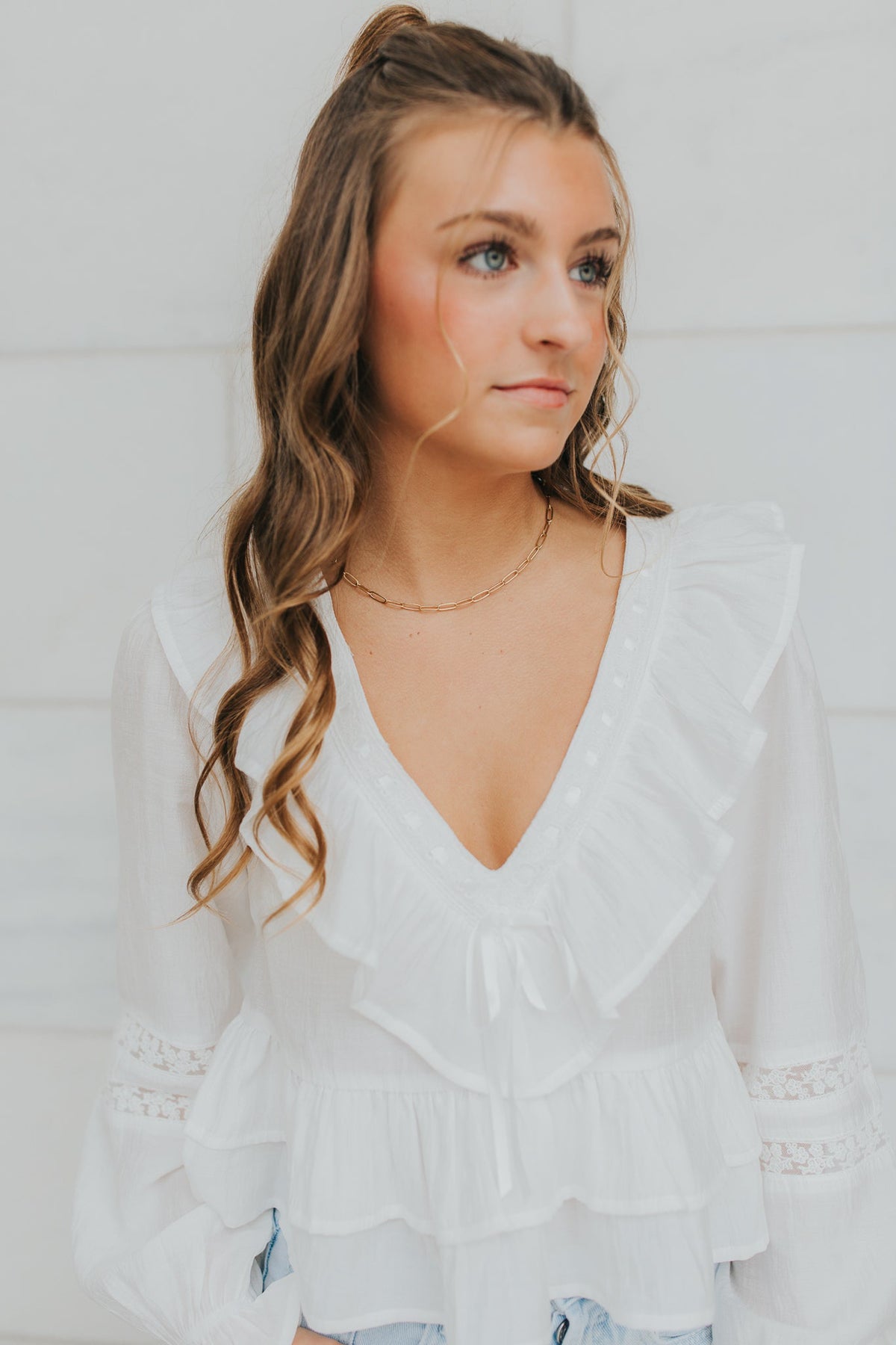 The Eloise Necklace displayed flat to show overall length, extender chain, and lobster clasp placement against a neutral backdrop for sizing context.