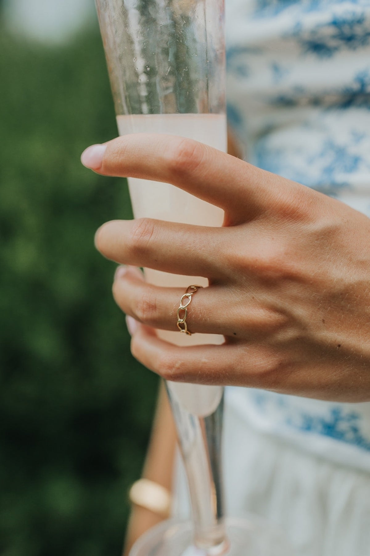 Macro image of The Emma Ring focusing on the polished link joins and smooth gold-plated surface, demonstrating texture and shine.