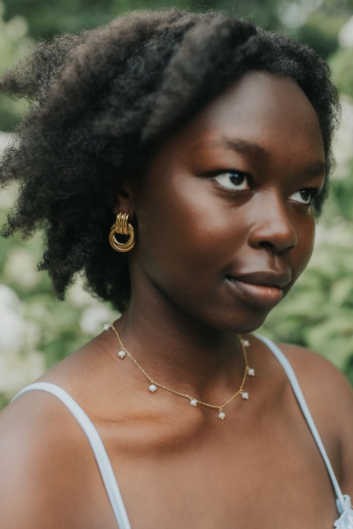 Detailed product image of Hailey Earrings displaying craftsmanship, interlocking hoop geometry, and the metal finish texture.