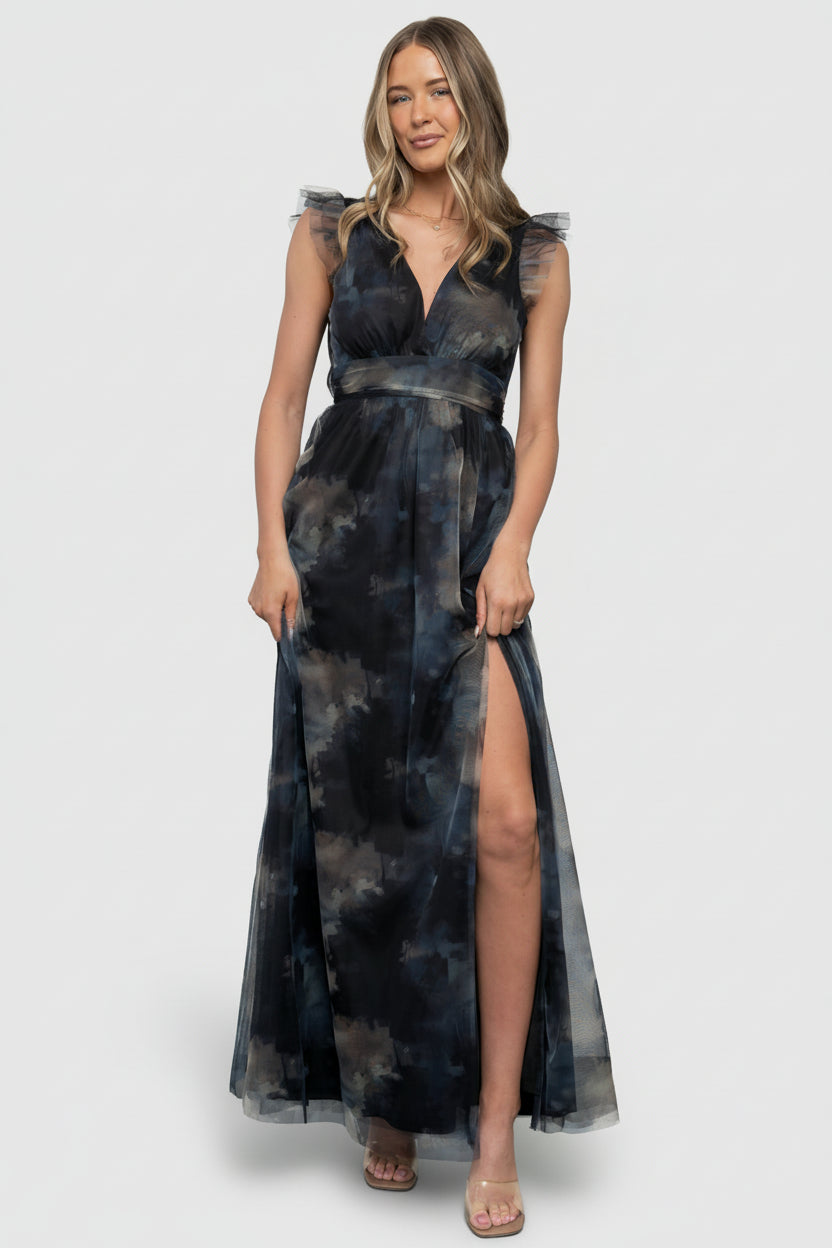 Front view of model in Midnight Floral Adelyn Maxi Dress showing deep V neckline, flutter tank sleeves, and full-length tulle skirt.