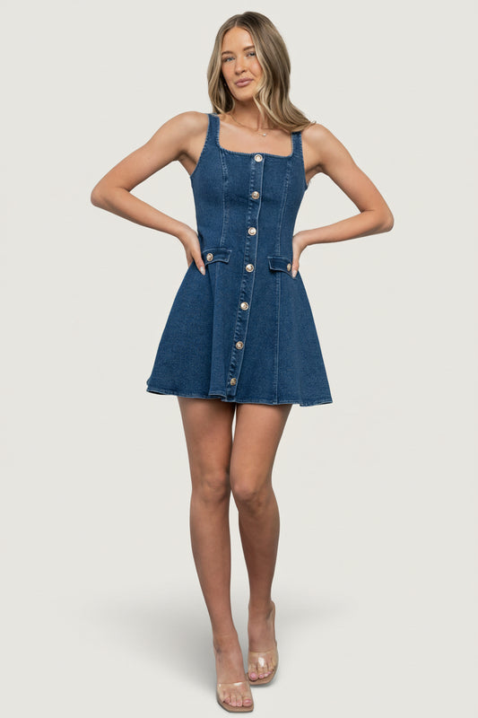 Front view of Mason denim mini dress (medium wash) on model, showing square neckline, button-front, fitted bodice, and flared skirt.