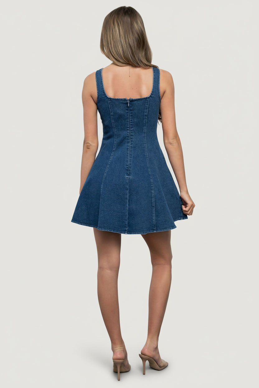 Close-up detail of the Mason mini dress button-front and seam detailing in medium-wash denim, showing structured fabric texture.