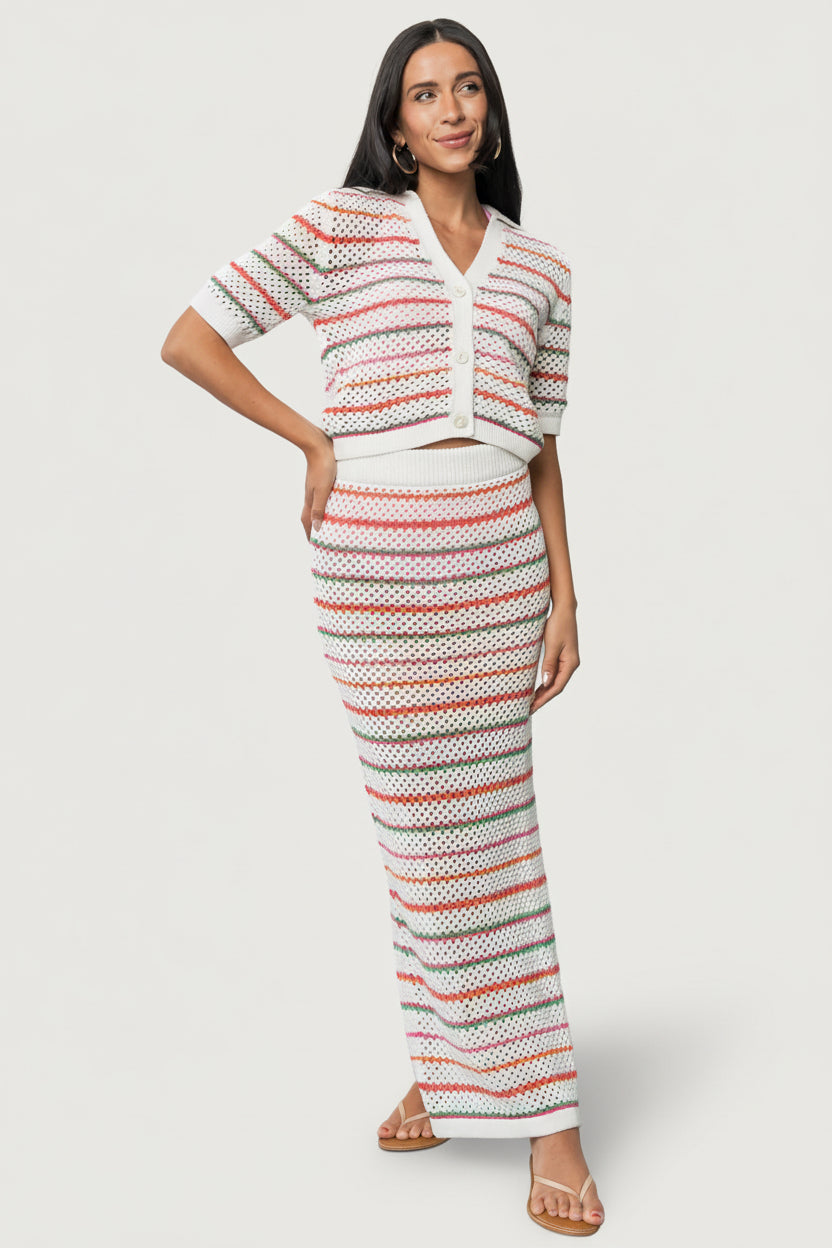 Back view of Viento Multistripe crochet cardigan on model showing slightly cropped length, multi-color stripes and breathable unlined construction.