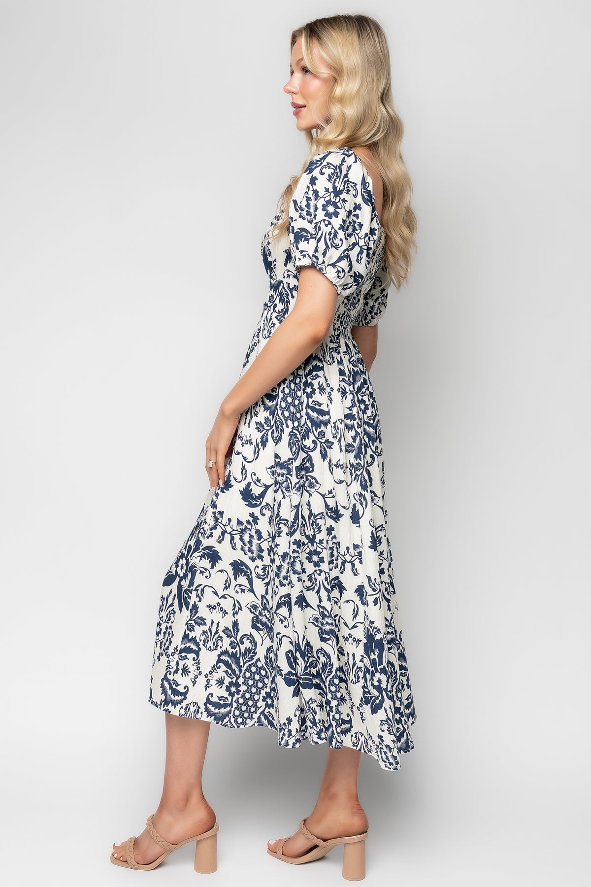 Detail shot of the banded front waist and functional side pocket on the Charlotte Midi Dress, demonstrating pocket opening and waist shaping.