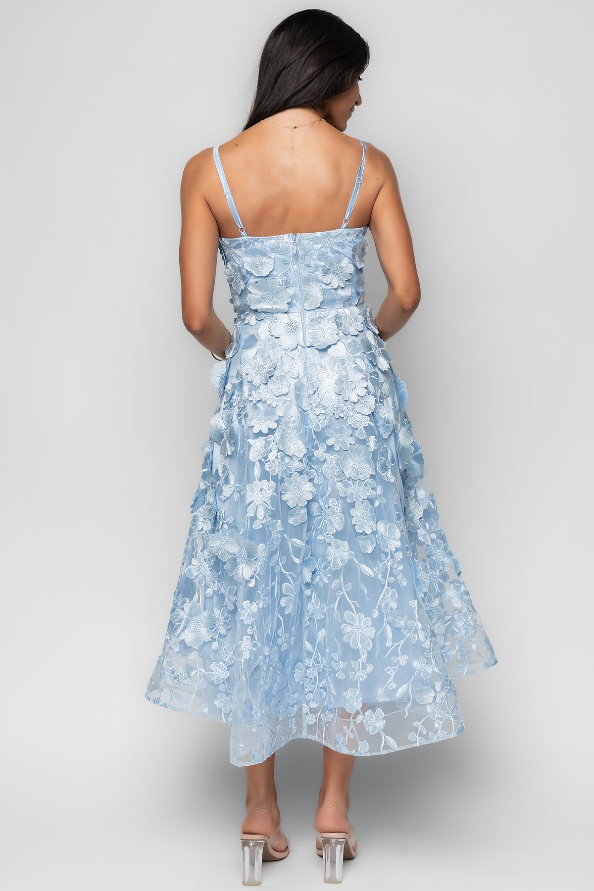 Back view of the dress displaying the concealed back zipper, seam lines, and how the skirt holds its shape.