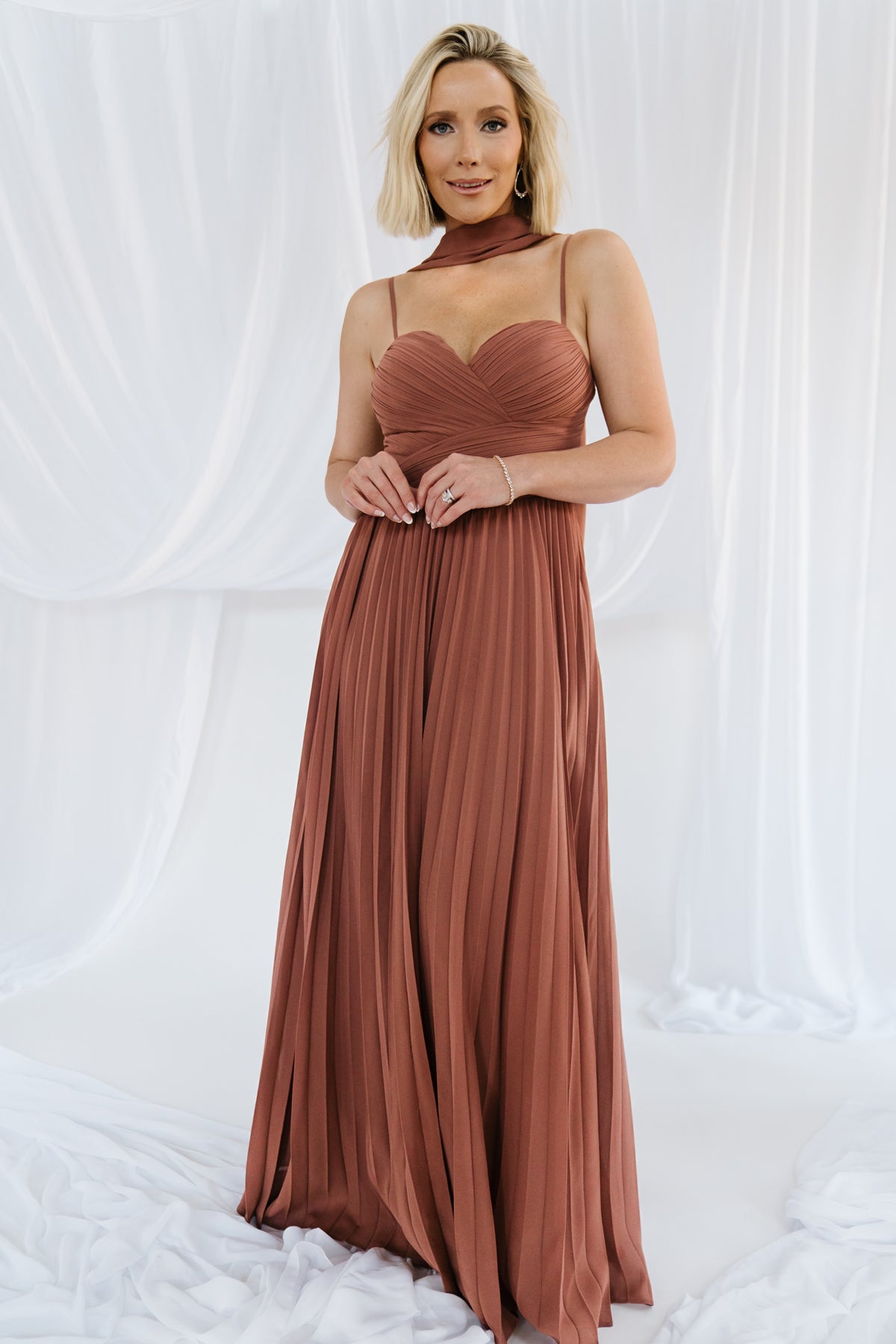 Front view of Georgina rosy brown pleated chiffon maxi dress on model, showing sweetheart neckline and included neck scarf clearly.