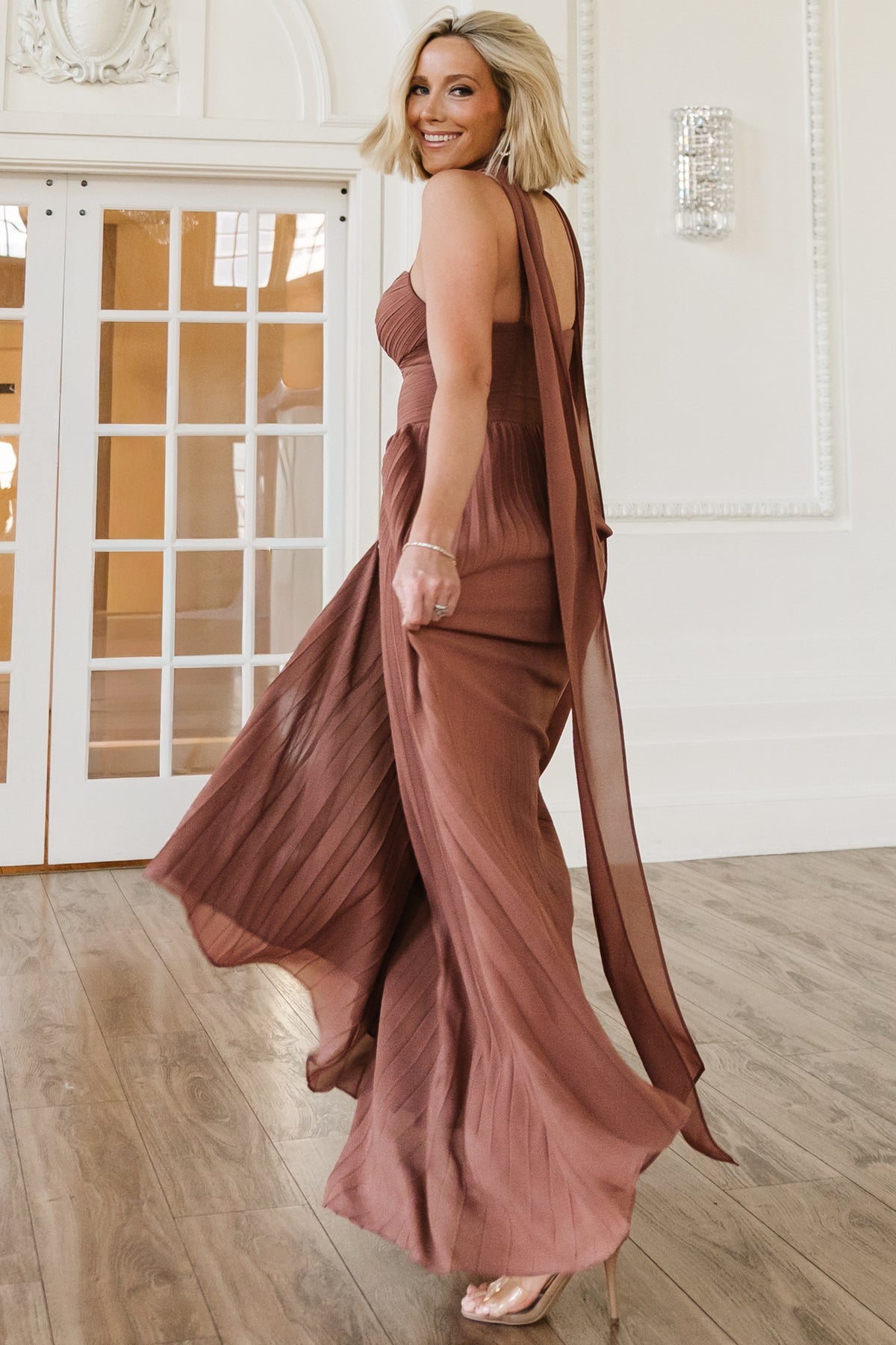 Close-up of pleated bodice and sweetheart neckline with silicone grip, showing fabric texture and pleat detailing in rosy brown.