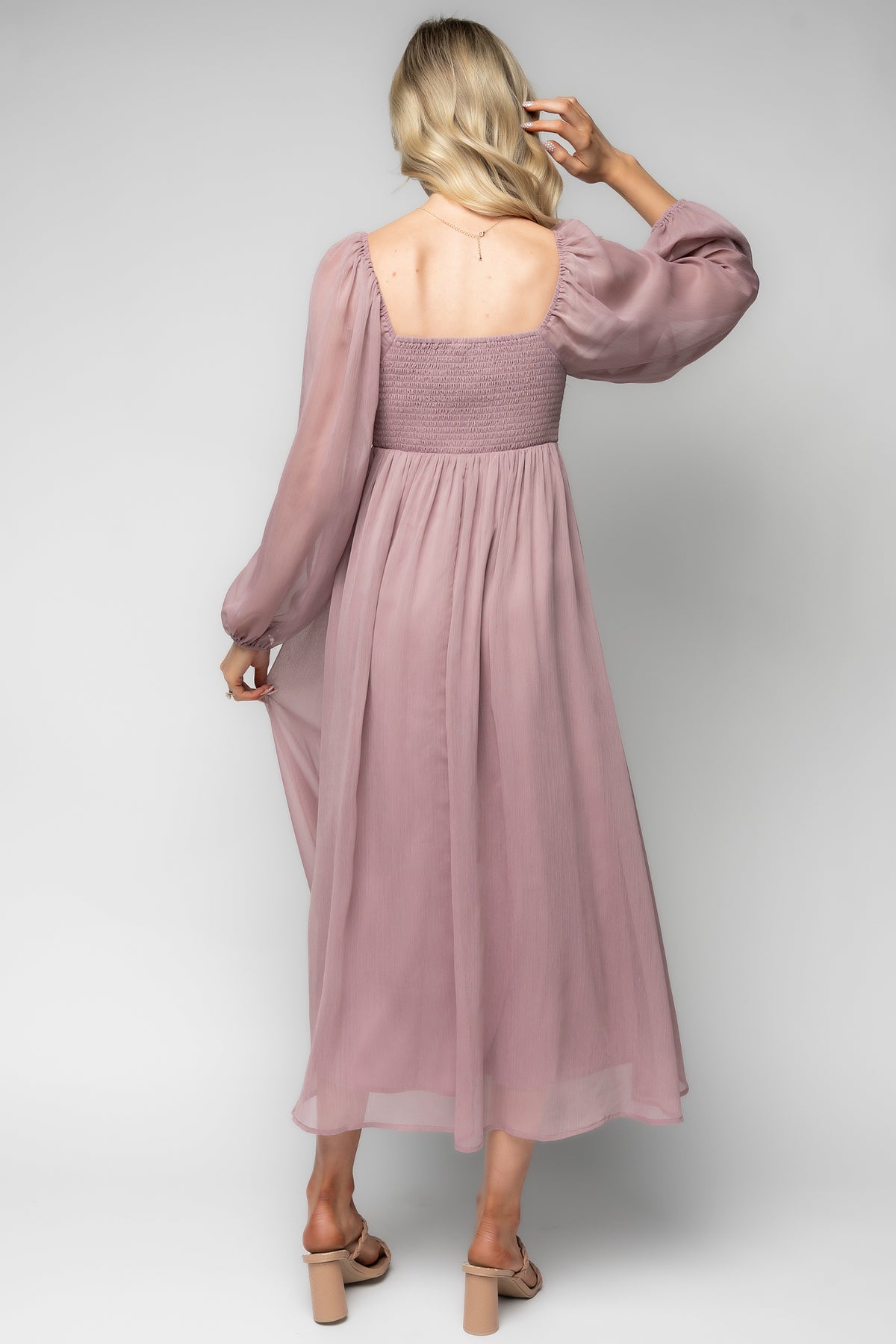 Close-up of the Dione Midi Dress knotted bust and horizontal seaming in dusty lilac georgette, emphasizing texture and tailoring.