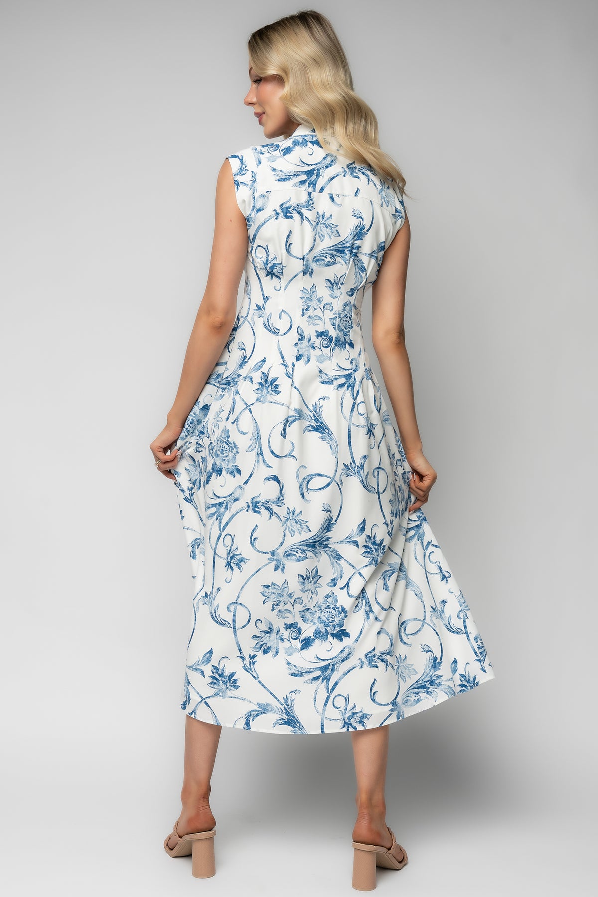 Detail shot showing hidden left-side zipper and the fully lined interior of the Tobias midi dress for a smooth silhouette.