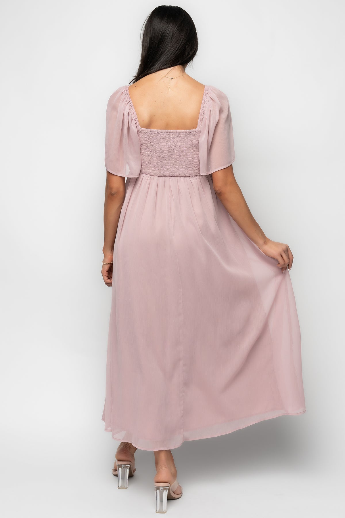 Side angle of Nora Midi Dress in dusty mauve showing flutter sleeve silhouette, empire waistline, and mid-calf skirt length.