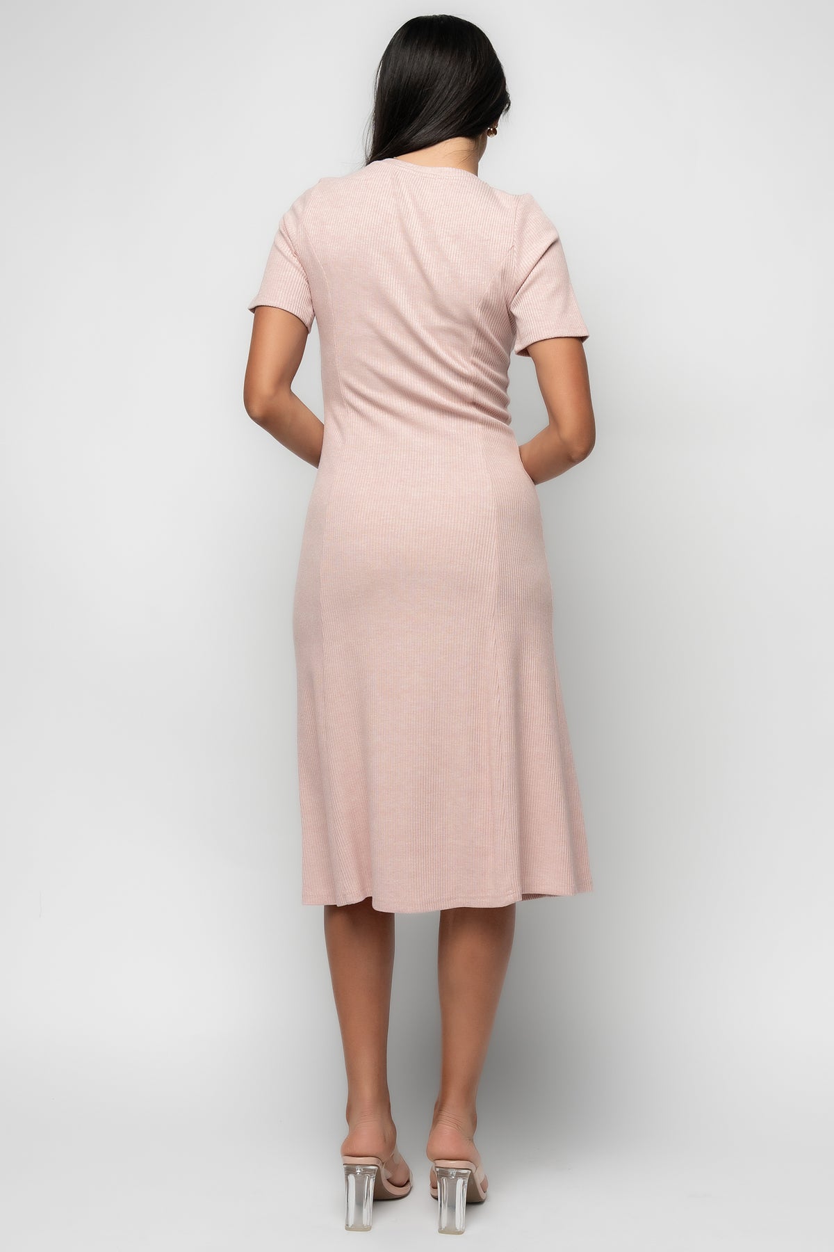 Close-up of button-front detail and ribbed knit texture on the Océane Midi Dress in blush pink for fabric reference.