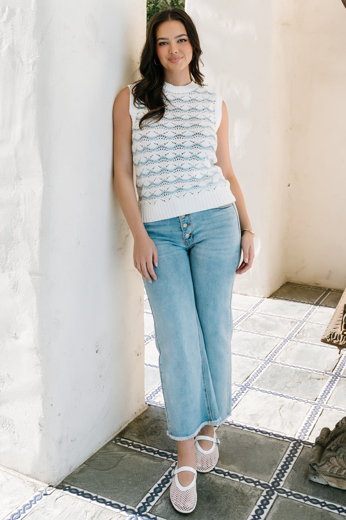 Model wearing Brody high-rise wide-leg jeans paired with a tucked top, showing ankle-length cropped fit and roomy leg opening.