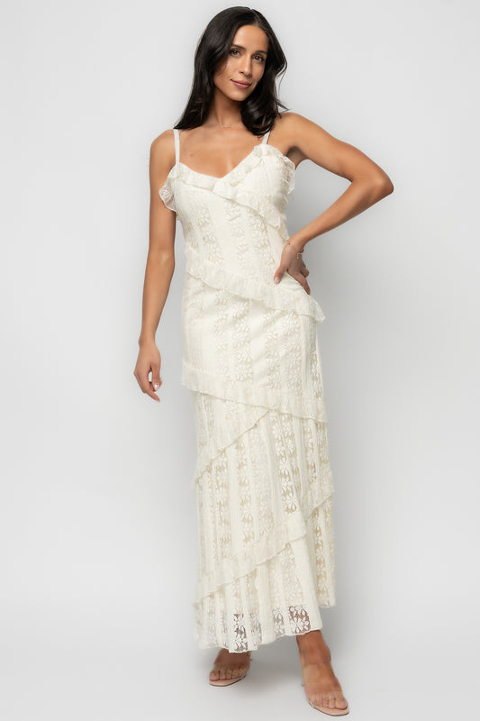 Front view of Annabelle Lace Maxi Dress in cream on model showing V-neck, close-to-body fit, and diagonal tiered lace skirt with soft lining (studio background).