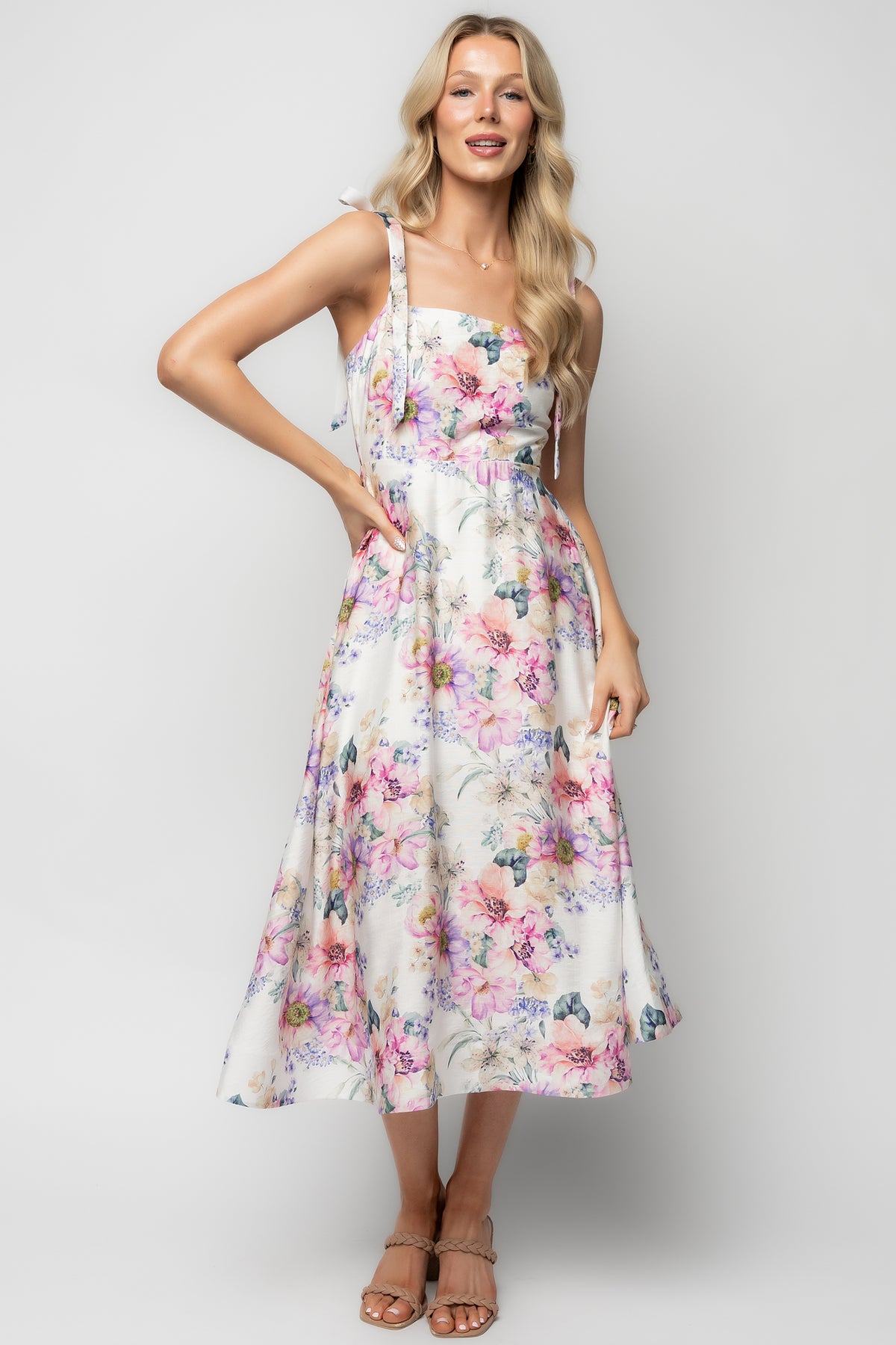 Three-quarter view of Opaline Midi Dress highlighting smocked back panel, partial lining, and structured net hem.