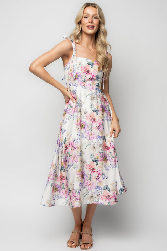 Three-quarter view of Opaline Midi Dress highlighting smocked back panel, partial lining, and structured net hem.