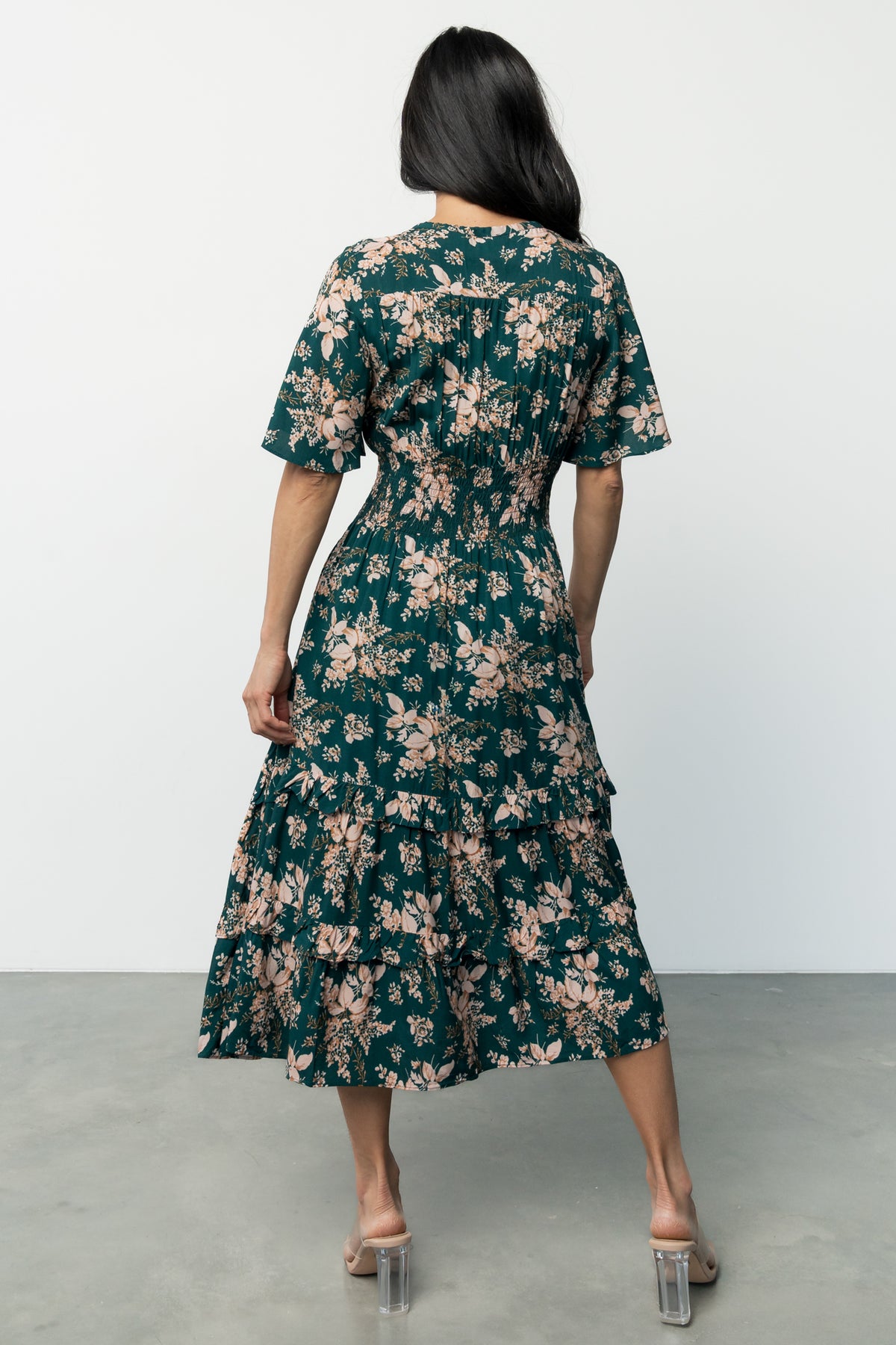Detail shot of the floral print and fabric texture on the Spell Boho Midi Dress, emphasizing soft rayon weave and color contrast.
