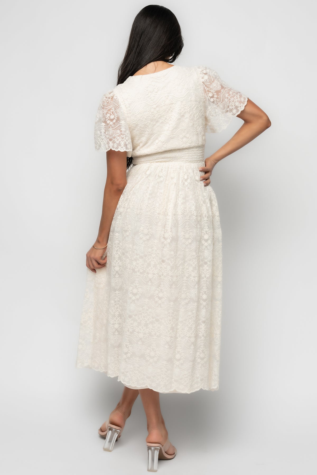 Close-up of Aphrodite dress bodice in vintage cream, showing V-neck detail, underbust contouring panel, and embroidered lace texture.