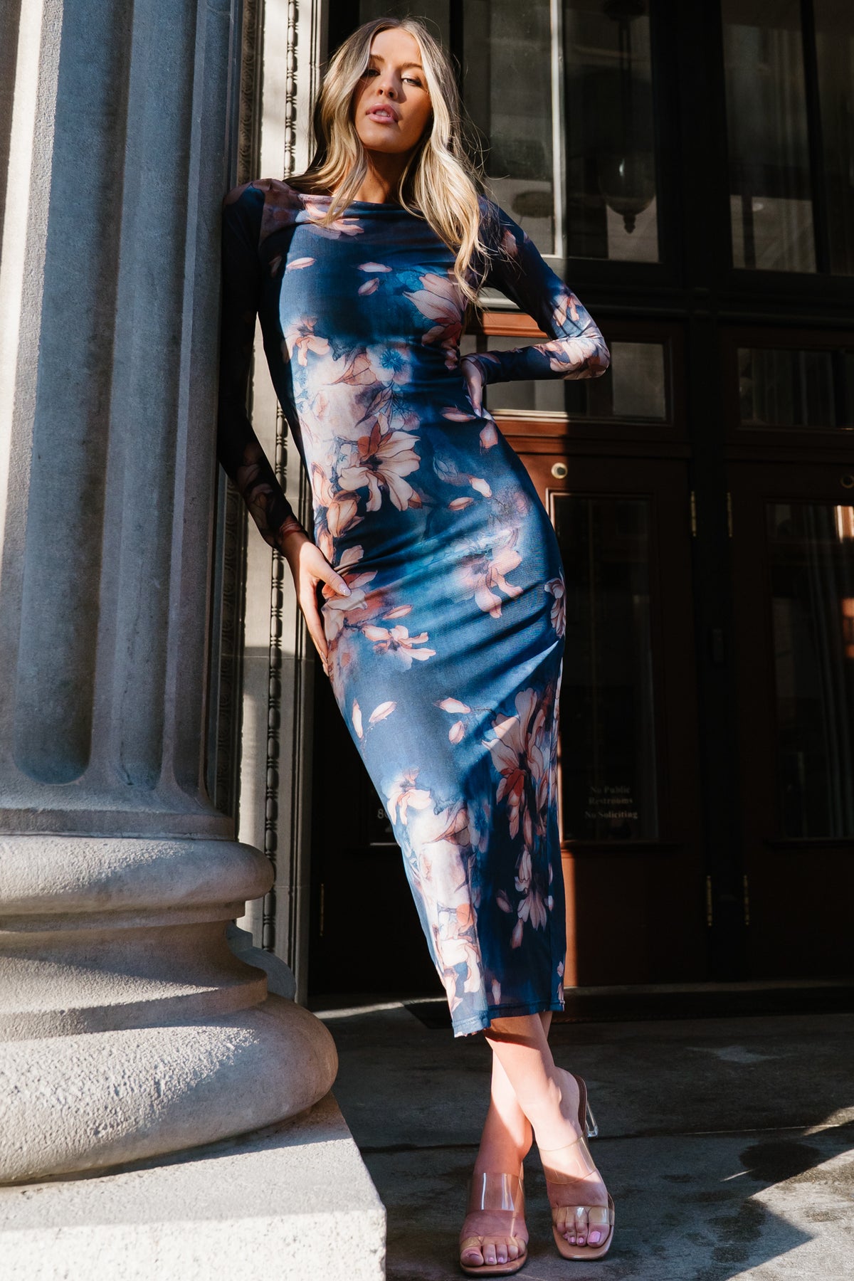 Back view of the Darya Mesh Midi Dress showing mesh overlay falling over the ribbed slip and the smooth silhouette of the bodycon midi length