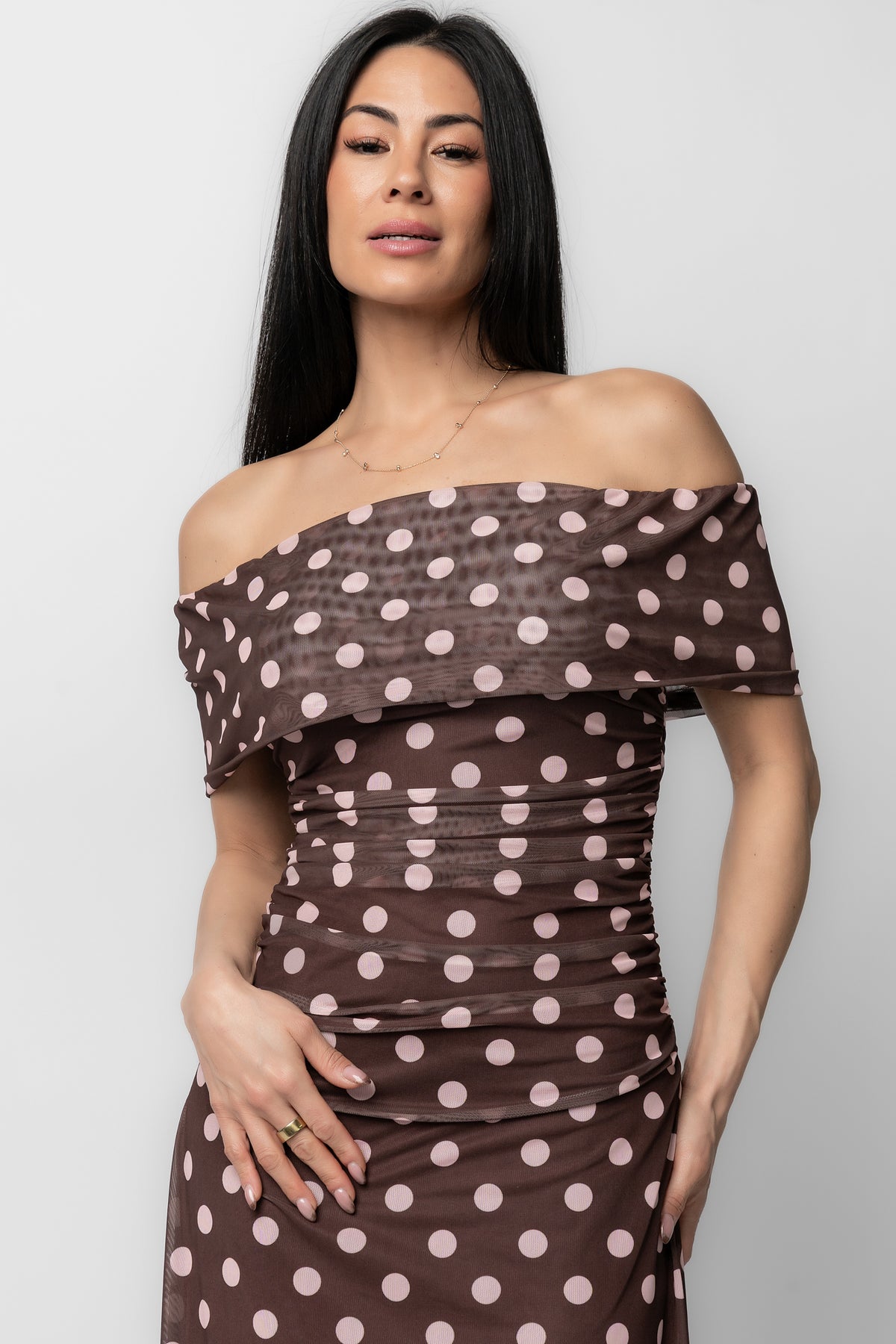 Back view of Maisie maxi dress showing discreet back zipper, fitted waist and full lined skirt in chocolate with blush polka dots.